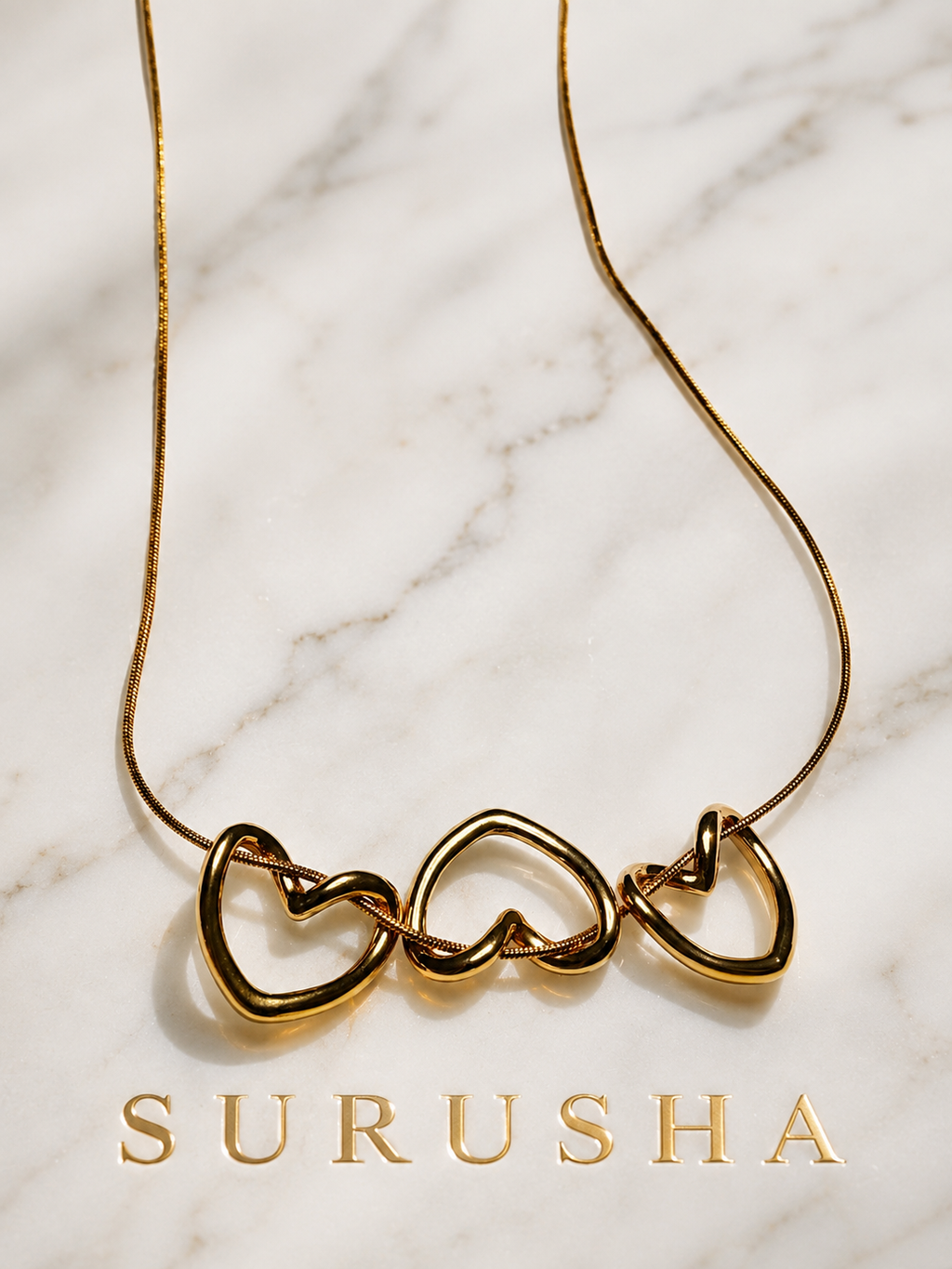 Triple Open Heart Snake Chain Necklace gold finish by Surusha